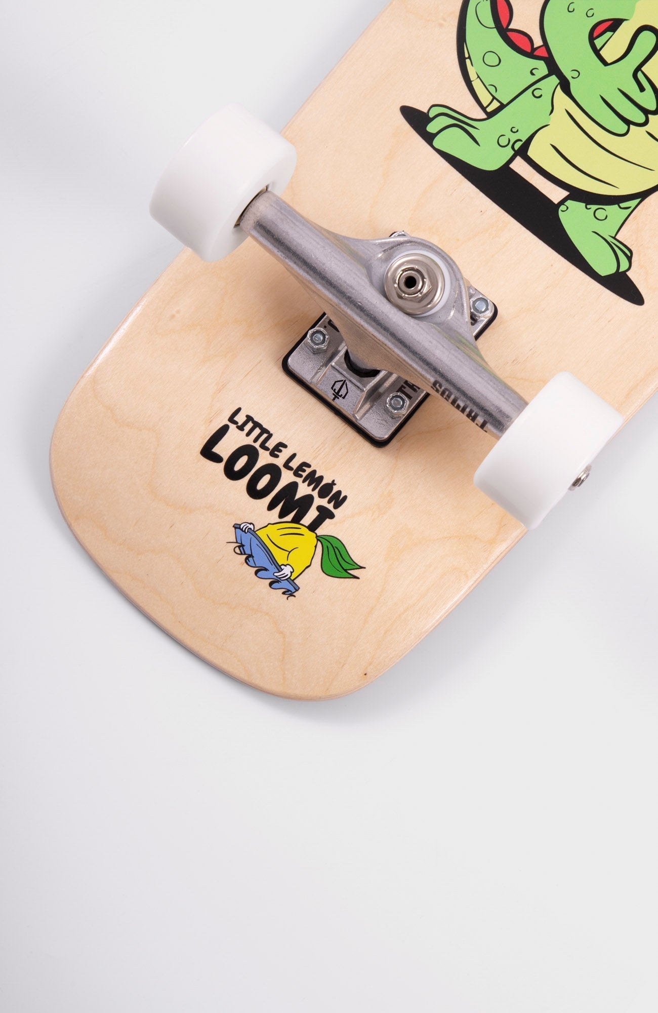 Kids skateboard detail of bottom graphic. A small lemon in a boat